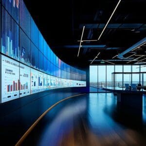 a sleek, modern office featuring multiple digital screens displaying vibrant mobile shopping analytics and trends, with a stylish yet minimalistic design reflecting a high-tech e-commerce environment.